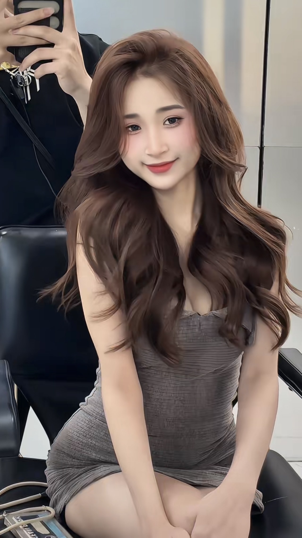Real warm caramel brown colour on softly waved hair at Nhat Tam Hair Salon