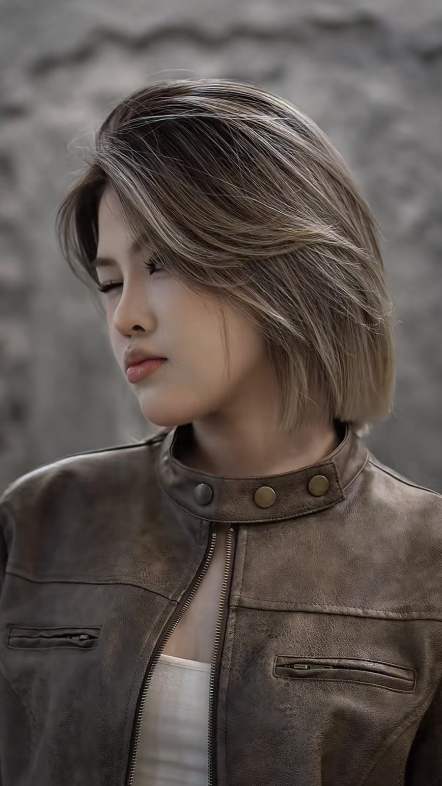 Chin length bob with a deep side part and ash blonde balayage over a darker root, created at Nhat Tam Hair Salon