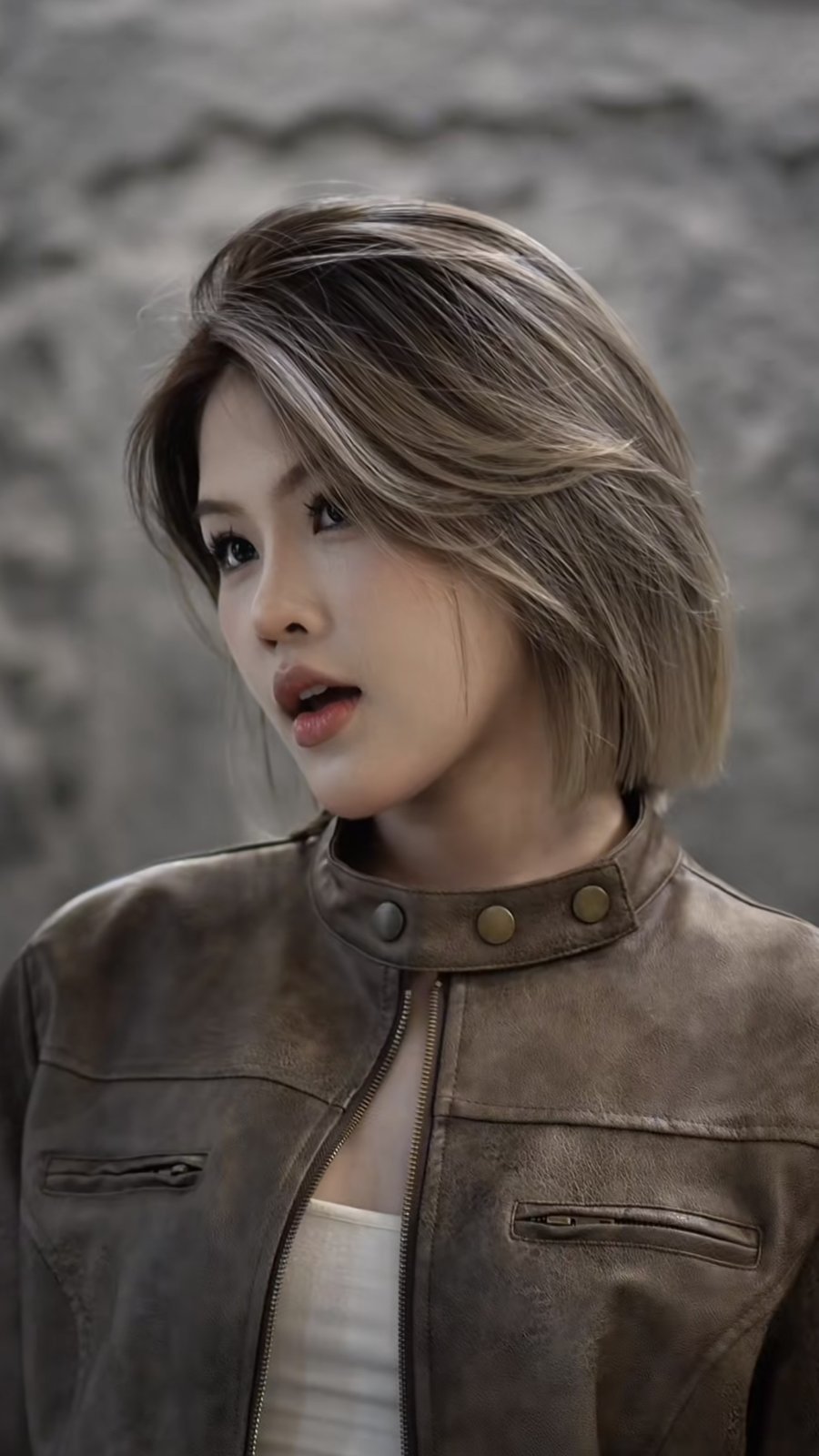Cool ash beige bob with a deep side part, a lightened shade from Nhat Tam Hair Salon Hanoi that needs regular toning on porous hair