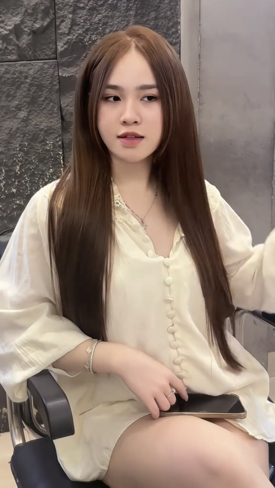 Deep mocha brown long straight hair after colouring at Nhat Tam Hair Salon Hanoi