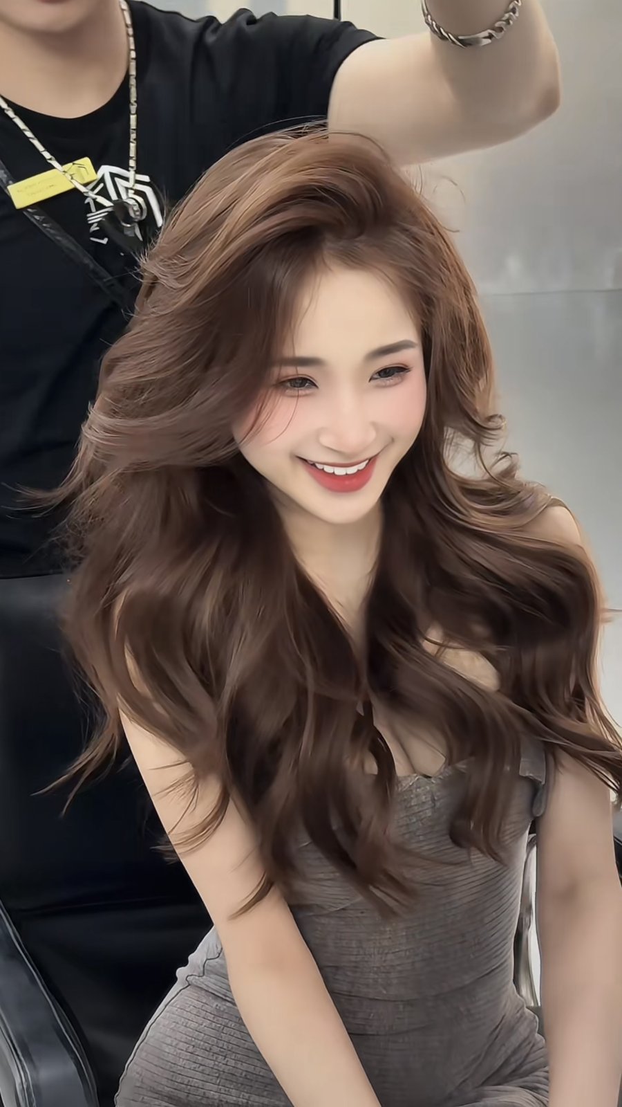 Light caramel brown voluminous waves styled at Nhat Tam Hair Salon Hanoi