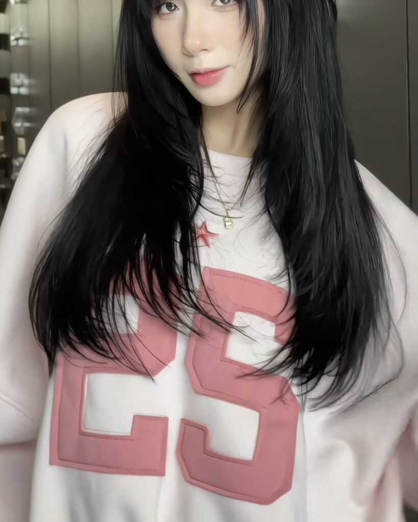 Long black layered hair result on a client at Nhat Tam Hair Salon in Hanoi
