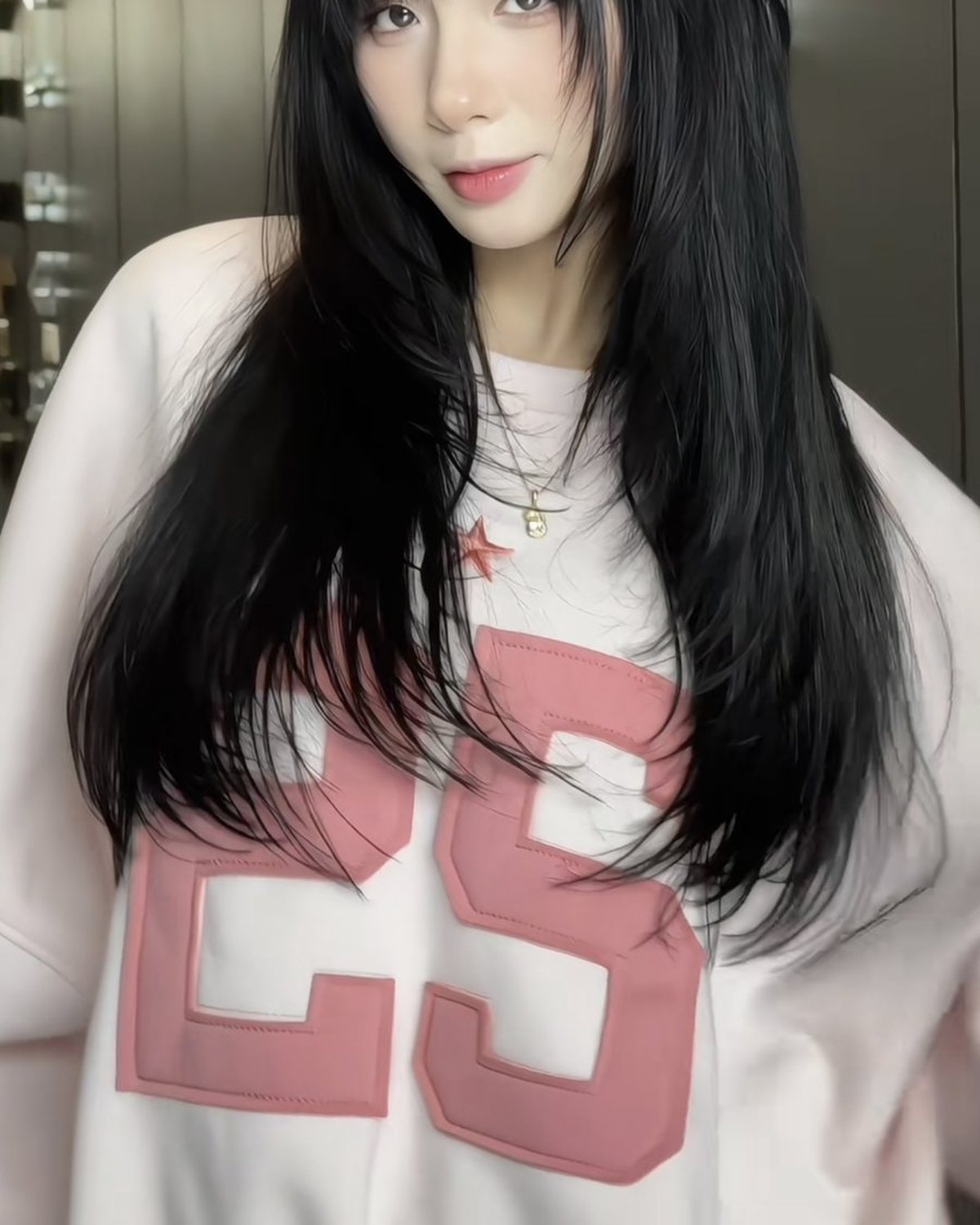 Long black layered hair result on a client at Nhat Tam Hair Salon in Hanoi