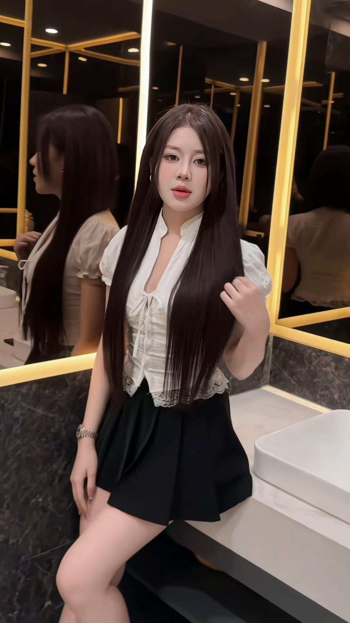 Long straight hair result photographed inside a Nhat Tam salon